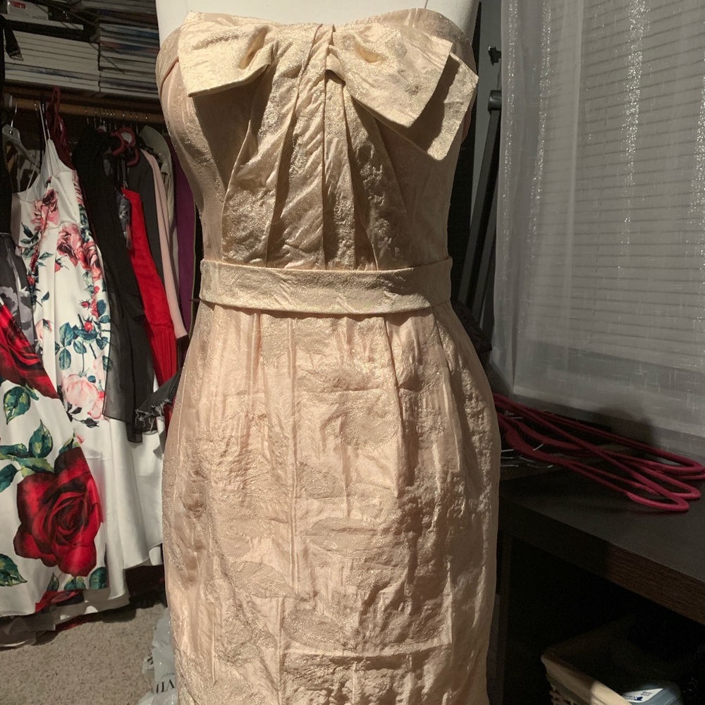 Short strapless rose gold dress with bow bodice